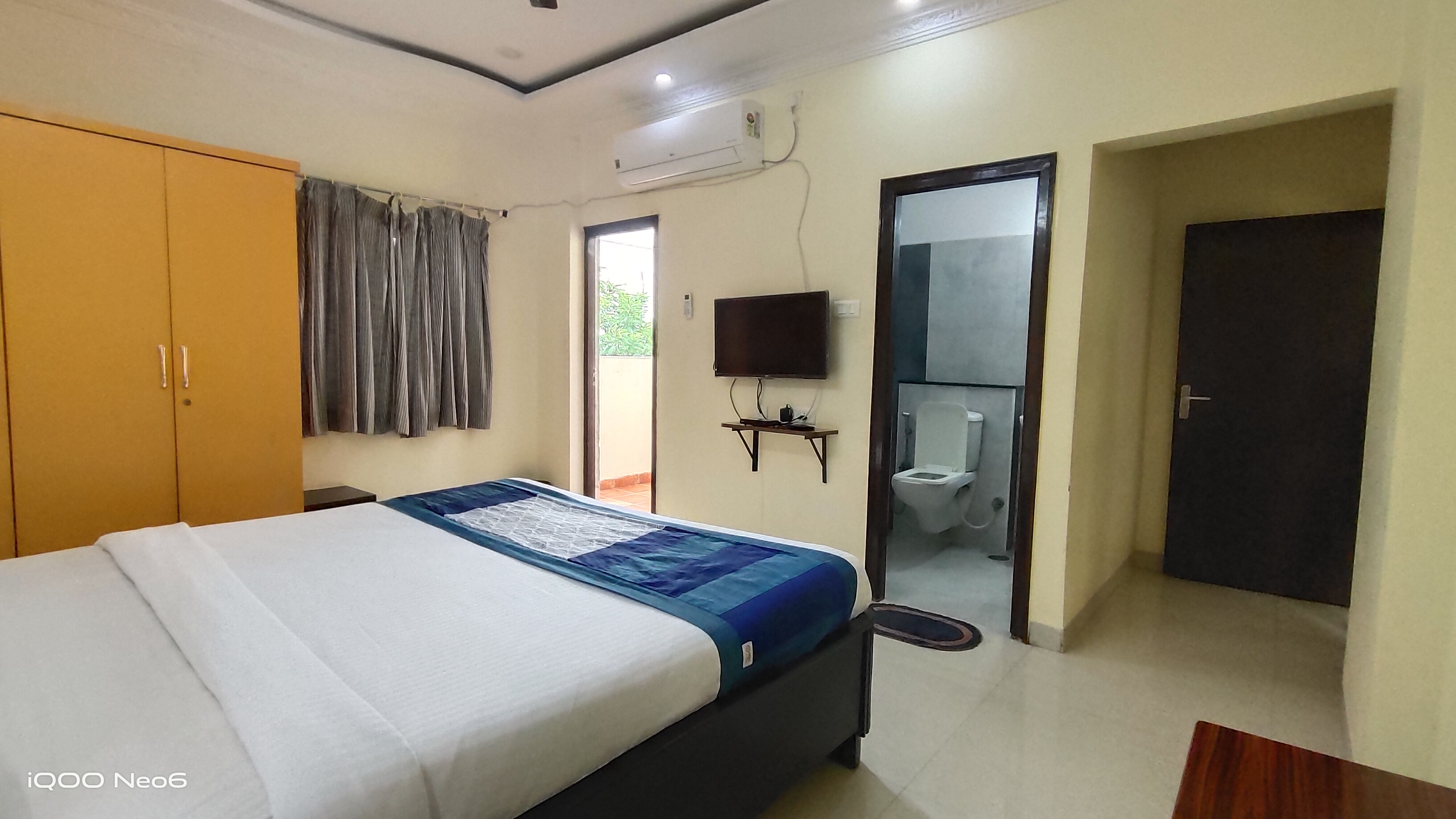Bedroom with balcony at Sunrise Serviced Apartments